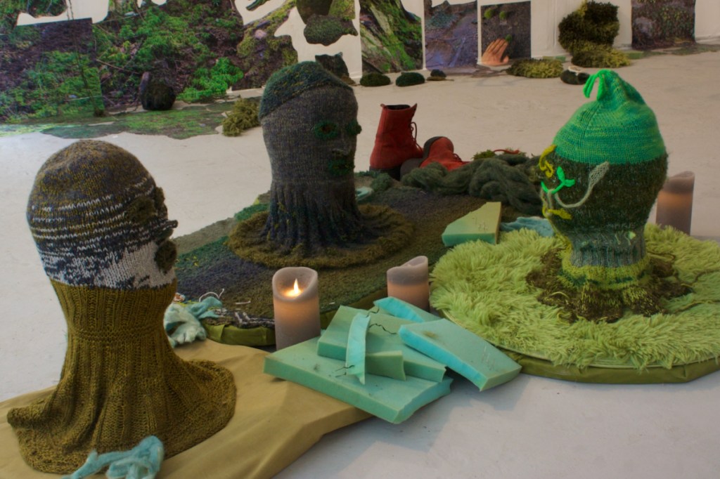 3 knitted heads in conversation